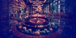 Gambaran permainan casino dan sports di layar dengan latar belakang neon